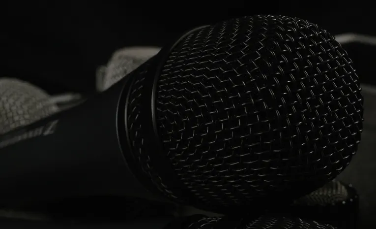 Close-up of a professional microphone representing AI voice cloning technology