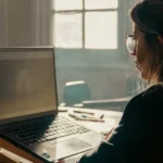 Student using a laptop with free AI writing tools for schoolwork