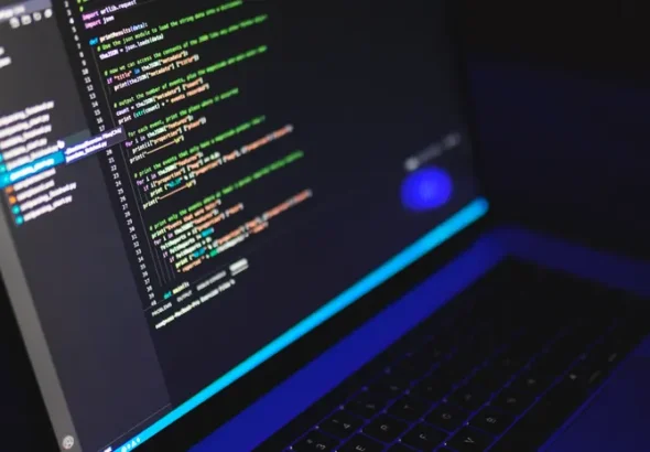Laptop screen showing code in a dark terminal environment for running local AI models