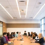 Group of professionals in a conference room meeting representing AI meeting note takers