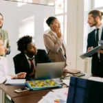 Diverse group of business professionals collaborating in a modern office meeting