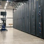 Server racks in a data center corridor representing cloud infrastructure security