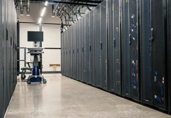 Server racks in a data center corridor representing cloud infrastructure security