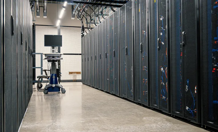 Server racks in a data center corridor representing cloud infrastructure security