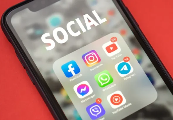Close-up of a smartphone screen showing app icons representing browser extensions