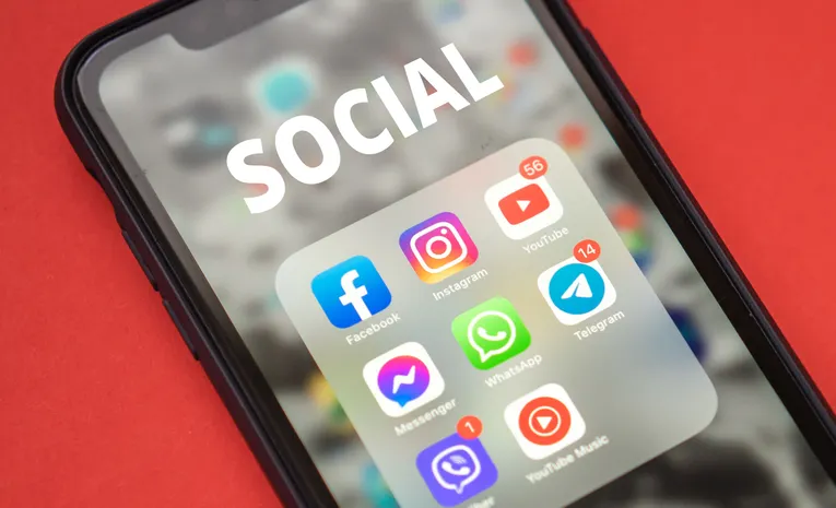 Close-up of a smartphone screen showing app icons representing browser extensions
