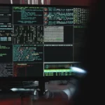 Person typing on a laptop keyboard with a security overlay representing GDPR compliant password management