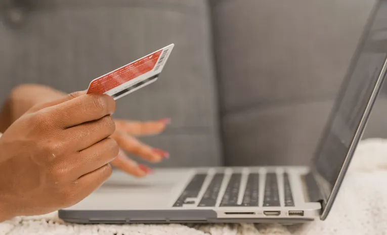 Person entering credit card details for an online subscription checkout