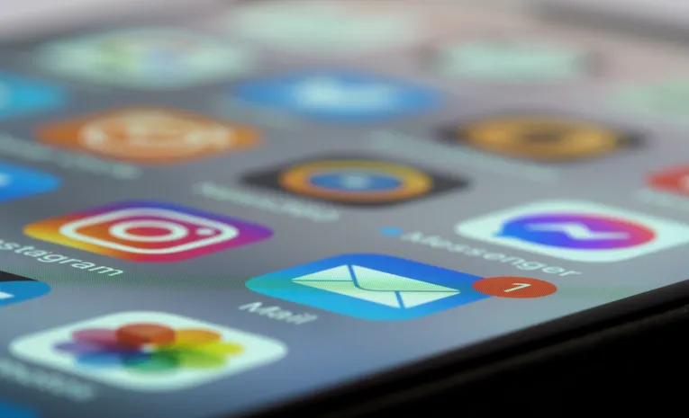 Close-up of smartphone screen showing multiple app icons representing SaaS sprawl