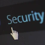 Close-up of a computer screen showing digital security text representing two-factor authentication