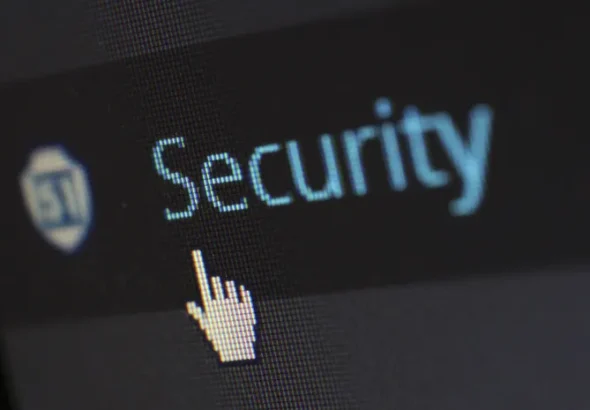 Close-up of a computer screen showing digital security text representing two-factor authentication