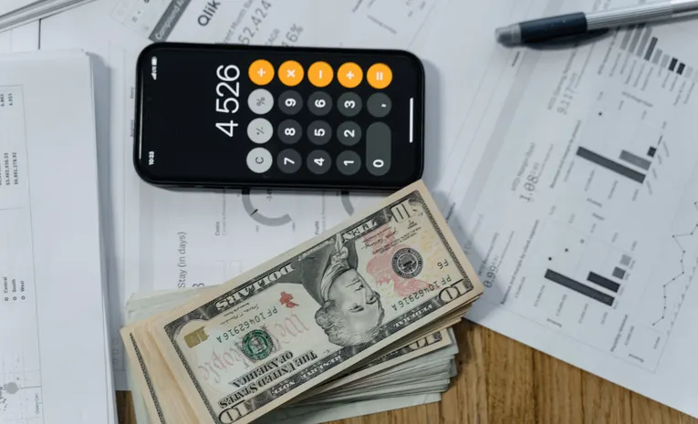 Person reviewing financial documents and credit card statements representing identity theft recovery