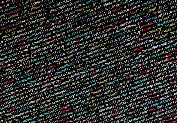 Colorful programming code on a screen representing software complexity and bloat