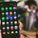 Smartphone showing app icons on a home screen representing app interface redesigns